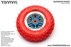 White Gloss and Black logo rim with Blue Anodised Spokes Red Alpha tyre and Red Bearings